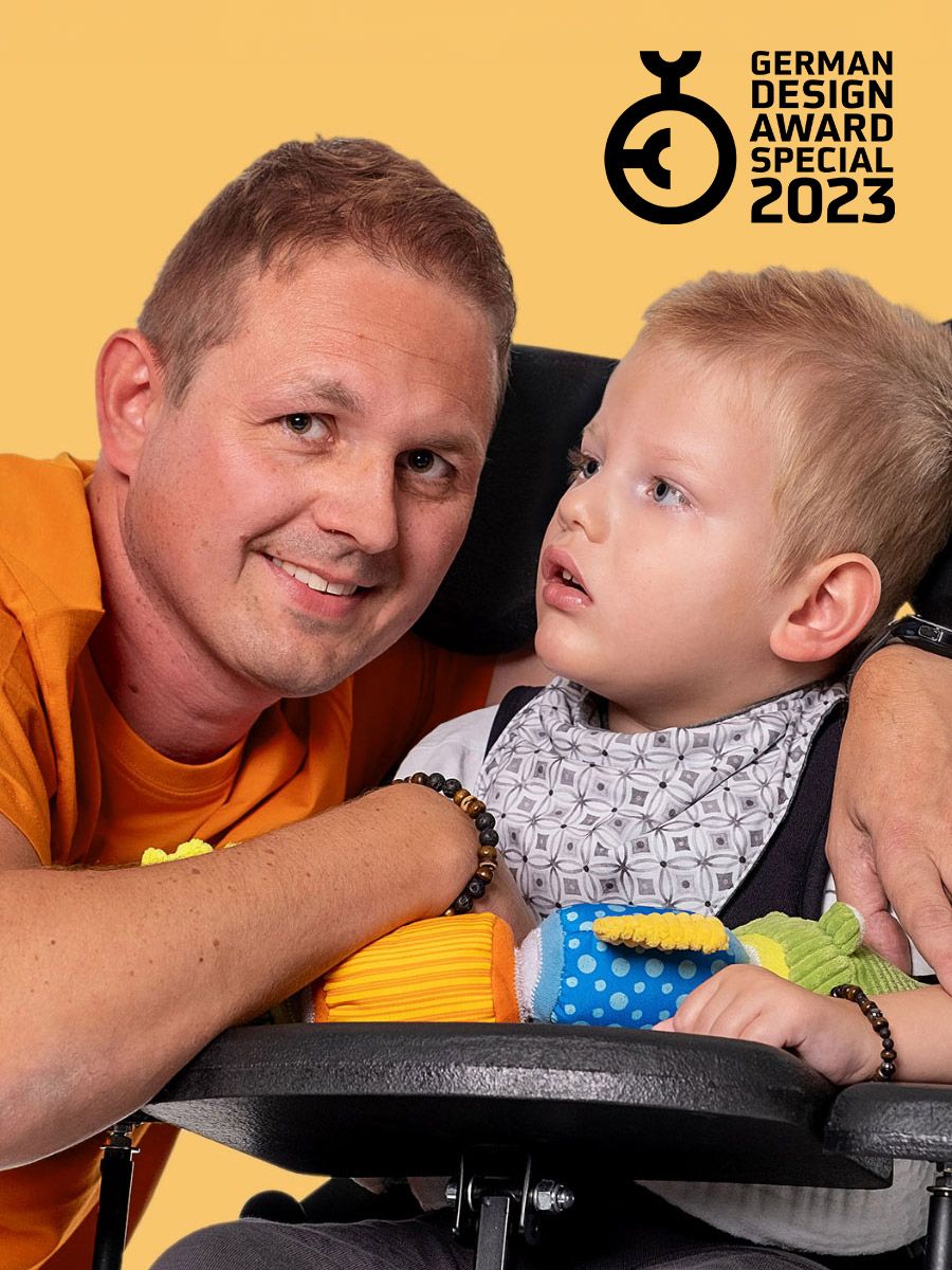 Vater mit seinem behinderten Kind